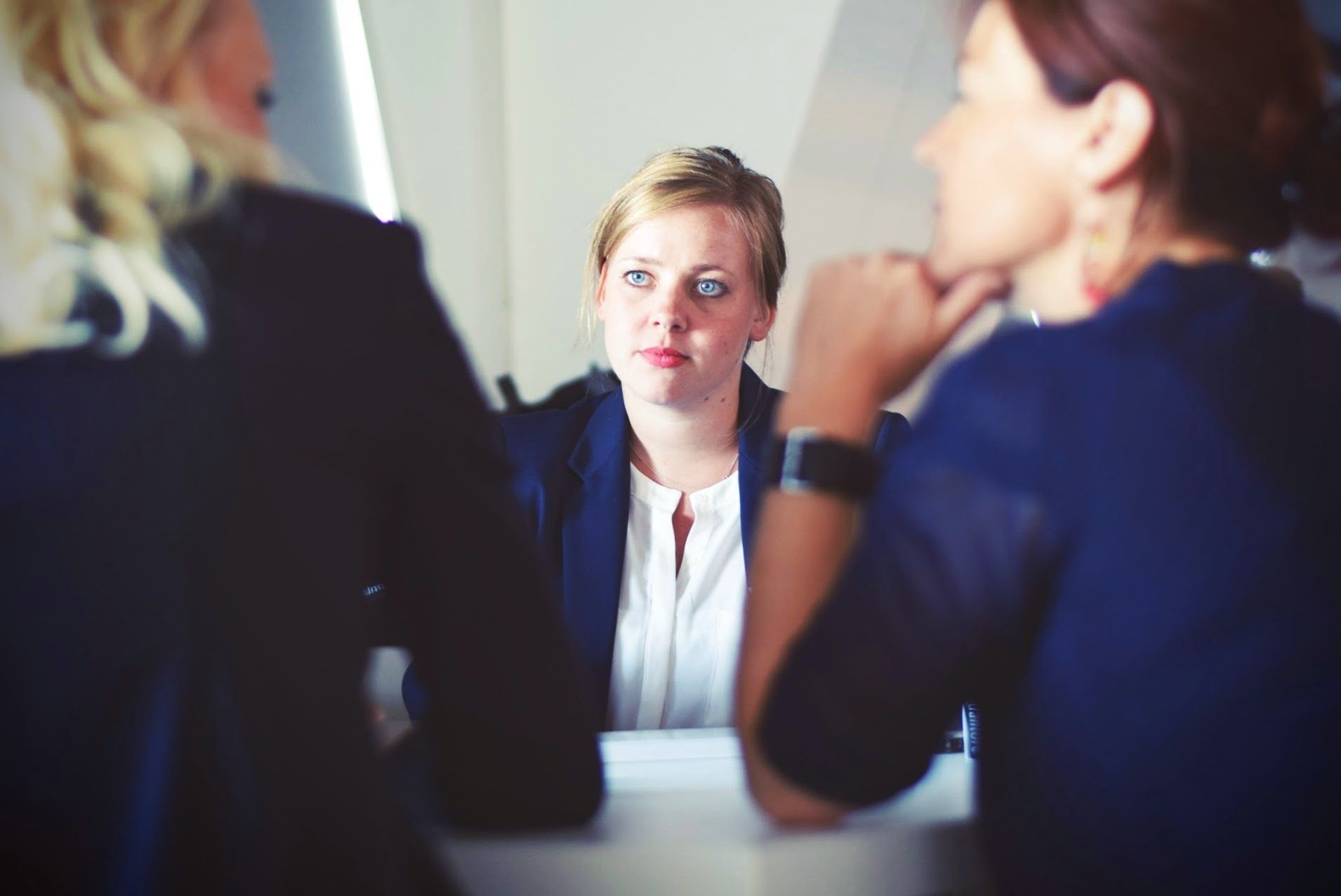 Three colleagues having a conversation.